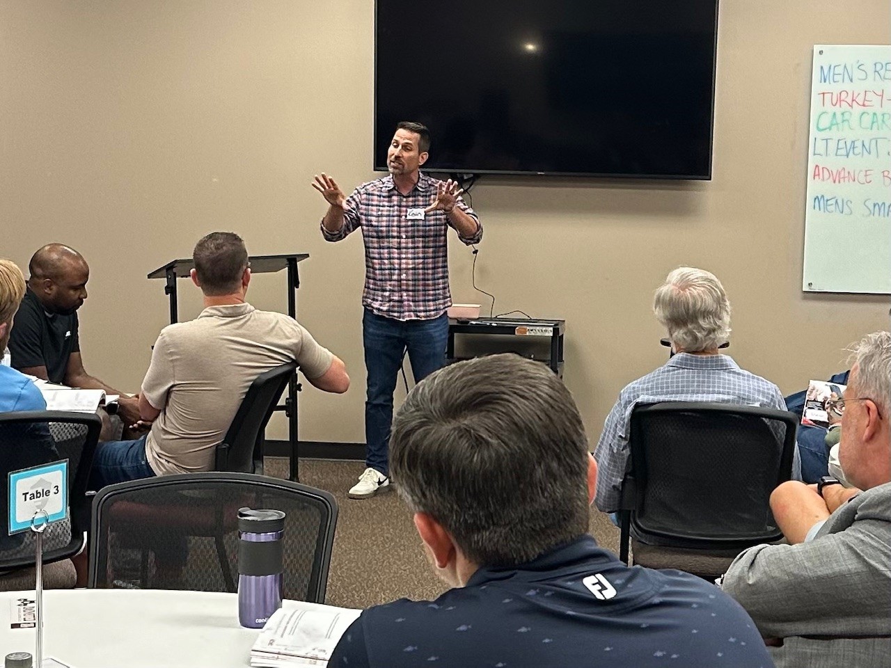Kevin facilitating a leadership discussion with a small group